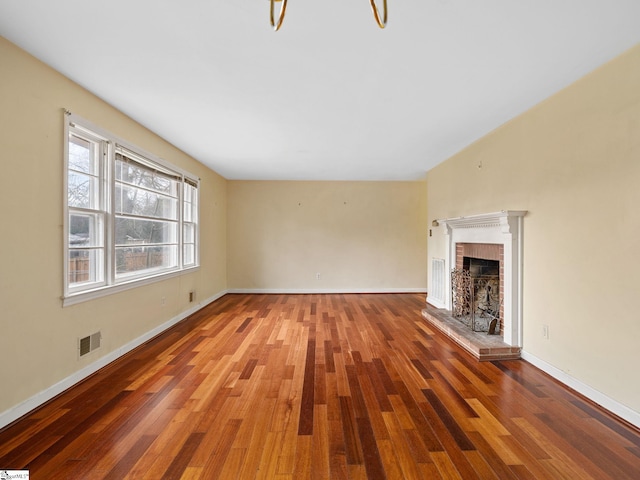 unfurnished living room with hardwood / wood-style floors