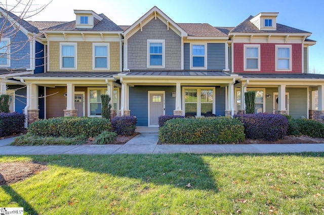 view of front facade featuring a porch and a front yard