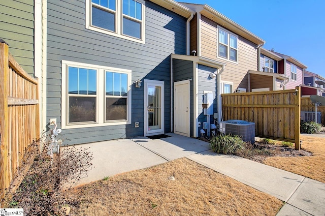 back of property featuring a patio area and cooling unit