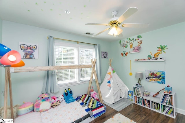 recreation room featuring ceiling fan and dark wood-type flooring