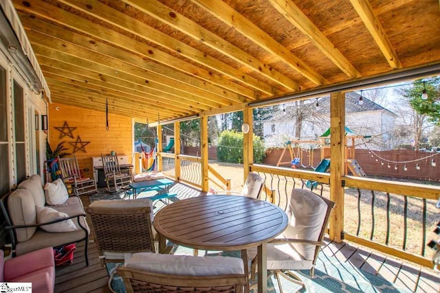 sunroom featuring lofted ceiling