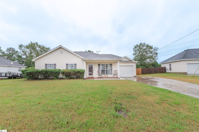 ranch-style home with a garage and a front lawn