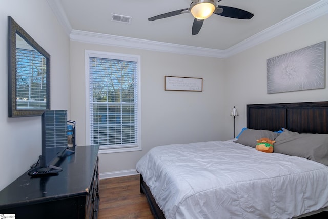 bedroom featuring dark wood-type flooring, ceiling fan, and crown molding