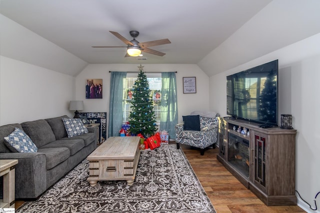 living room featuring hardwood / wood-style flooring, ceiling fan, and lofted ceiling