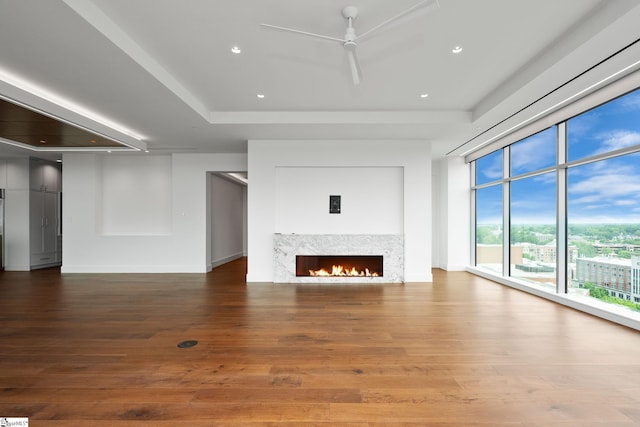 unfurnished living room with hardwood / wood-style floors and ceiling fan