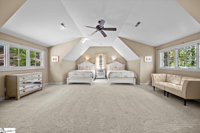 carpeted bedroom with ceiling fan and lofted ceiling