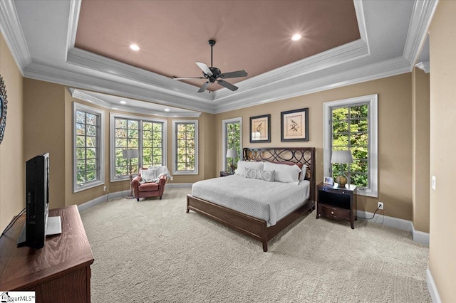 bedroom featuring ceiling fan, a raised ceiling, and ornamental molding