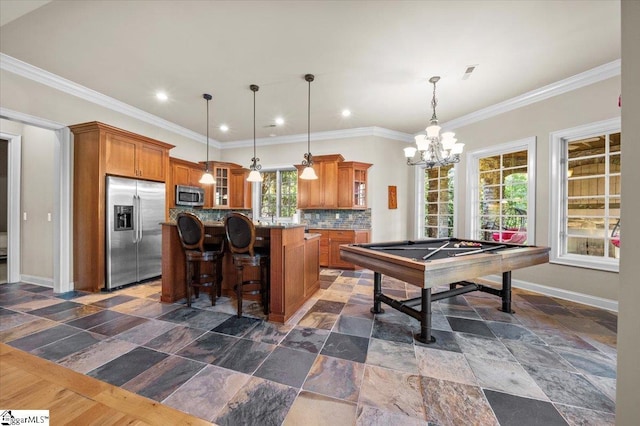 rec room with crown molding, an inviting chandelier, and billiards