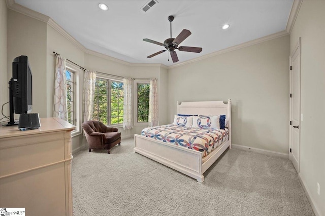 bedroom featuring ceiling fan, light colored carpet, and crown molding