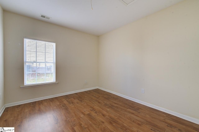 spare room featuring hardwood / wood-style floors