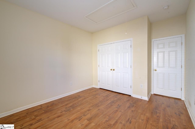 unfurnished bedroom featuring wood-type flooring