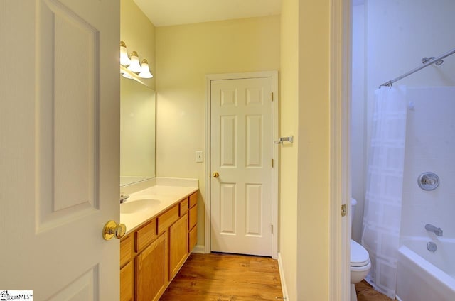 full bathroom with hardwood / wood-style floors, vanity, toilet, and shower / bathtub combination with curtain