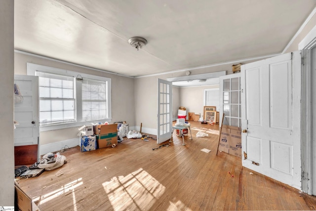 misc room with hardwood / wood-style flooring and french doors