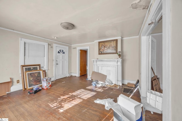 living room with hardwood / wood-style floors and ornamental molding