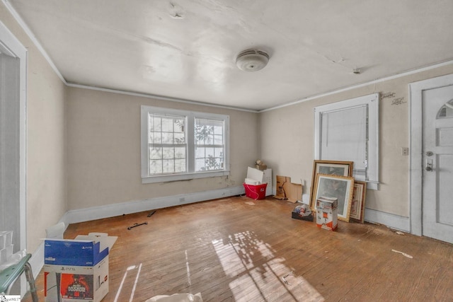 misc room featuring hardwood / wood-style floors and crown molding