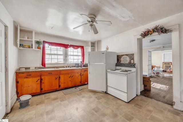 kitchen featuring ceiling fan, white appliances, and sink