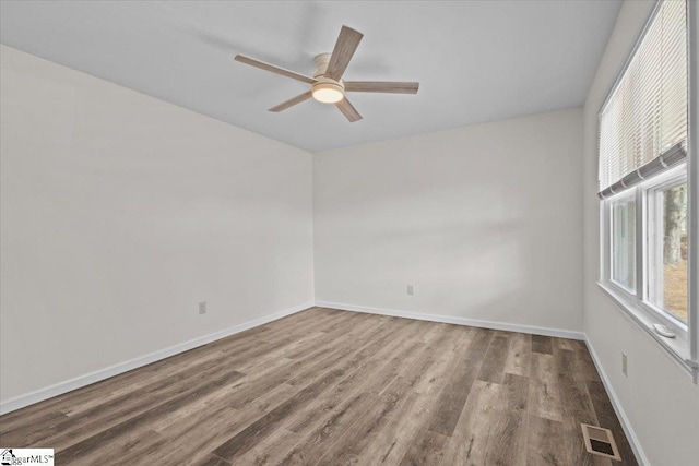 empty room with wood-type flooring and ceiling fan