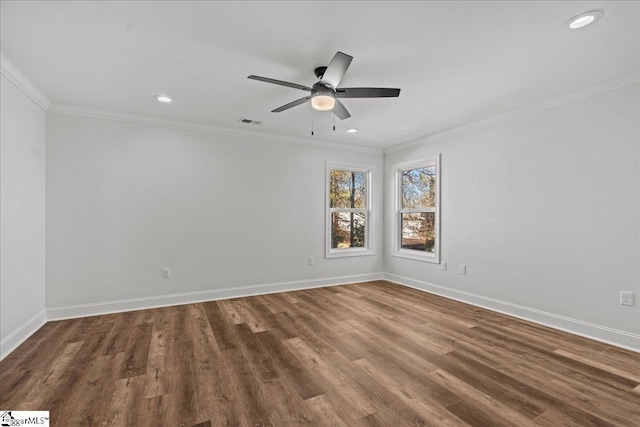 empty room with ceiling fan, wood-type flooring, and crown molding