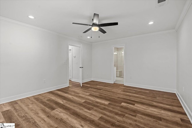 spare room featuring ceiling fan, dark hardwood / wood-style floors, and ornamental molding