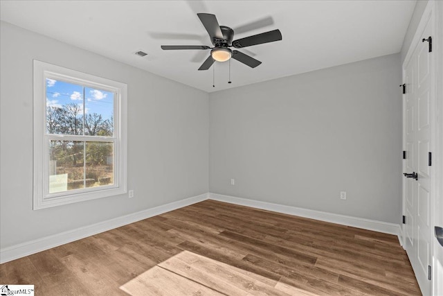 unfurnished room featuring ceiling fan and wood-type flooring