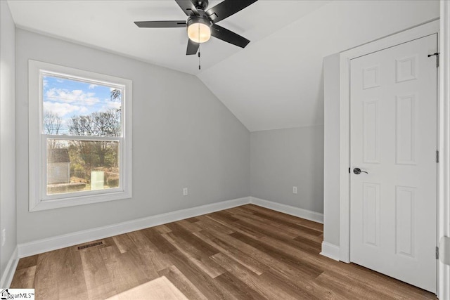 bonus room featuring hardwood / wood-style flooring, ceiling fan, and lofted ceiling