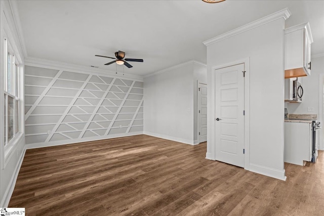 unfurnished living room with hardwood / wood-style floors, ceiling fan, and ornamental molding