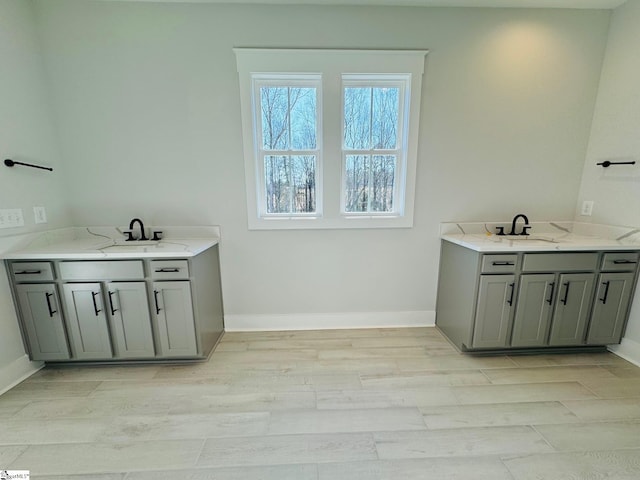 interior space featuring sink and light hardwood / wood-style flooring