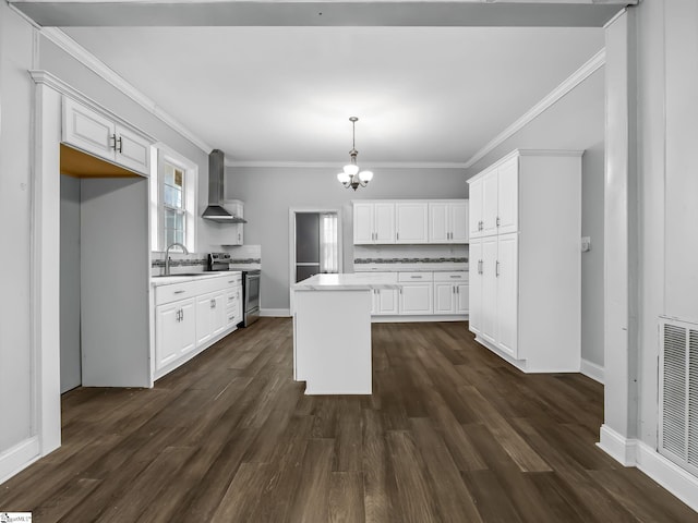 13 Damson St, Spartanburg, SC 29303 - kitchen with stainless steel electric stove, a kitchen island, white cabinets, and wall chimney range hood