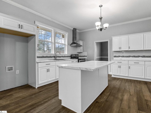 13 Damson St, Spartanburg, SC 29303 - kitchen featuring white cabinets, wall chimney range hood, hanging light fixtures, electric range, and decorative backsplash