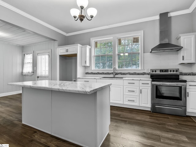 13 Damson St, Spartanburg, SC 29303 - kitchen with white cabinets, wall chimney exhaust hood, decorative light fixtures, and stainless steel range with electric cooktop
