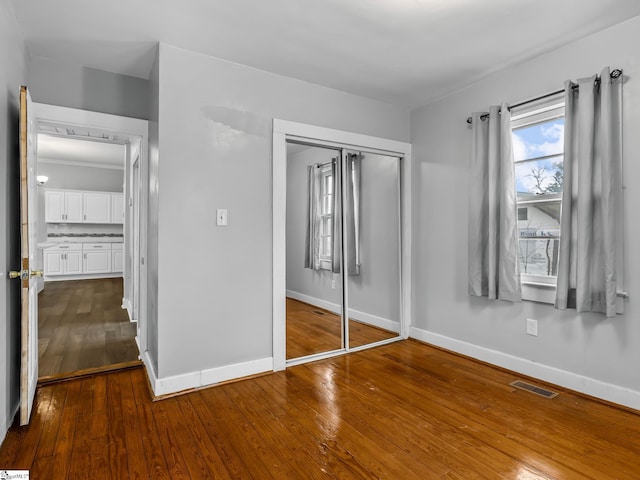 13 Damson St, Spartanburg, SC 29303 - unfurnished bedroom featuring a closet and wood-type flooring
