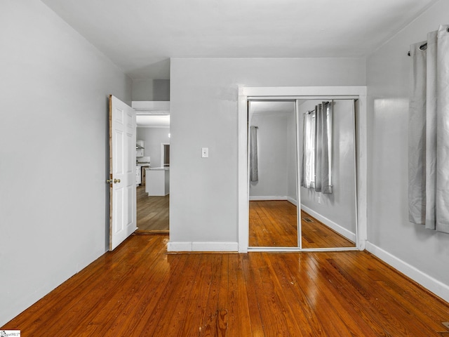 13 Damson St, Spartanburg, SC 29303 - unfurnished bedroom with a closet and hardwood / wood-style flooring