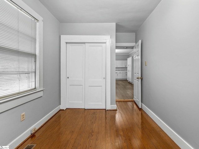 13 Damson St, Spartanburg, SC 29303 - unfurnished bedroom with hardwood / wood-style flooring and a closet