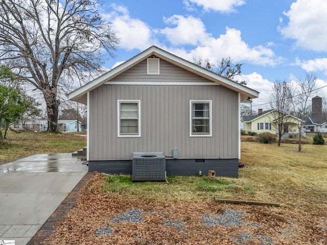 13 Damson St, Spartanburg, SC 29303 - view of side of property with central air condition unit and a yard
