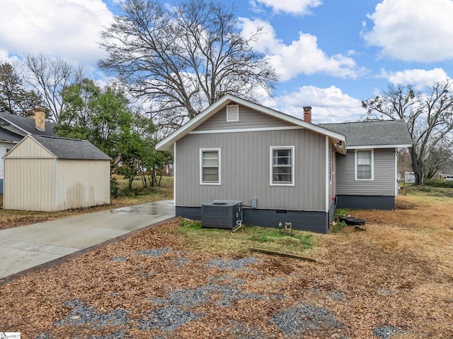 13 Damson St, Spartanburg, SC 29303 - view of side of home featuring central AC and an outdoor structure