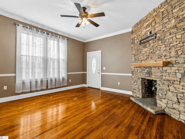 13 Damson St, Spartanburg, SC 29303 - unfurnished living room featuring ceiling fan, dark hardwood / wood-style flooring, ornamental molding, and a fireplace
