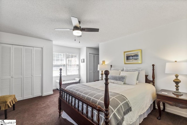 carpeted bedroom with two closets, ceiling fan, and a textured ceiling