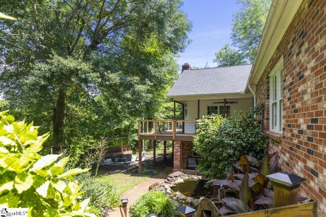 view of yard featuring ceiling fan