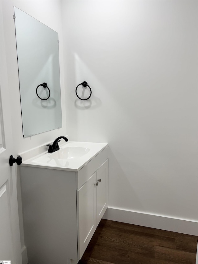 bathroom featuring vanity and hardwood / wood-style flooring