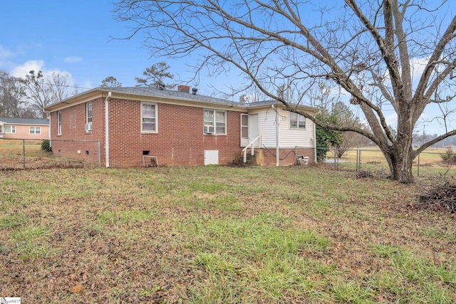 back of house with a yard