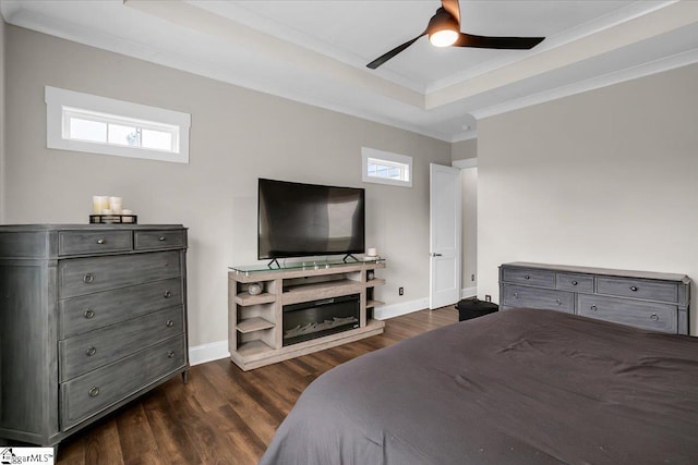 bedroom featuring ceiling fan, dark hardwood / wood-style flooring, crown molding, and multiple windows