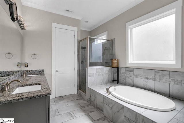 bathroom featuring vanity, crown molding, and plus walk in shower