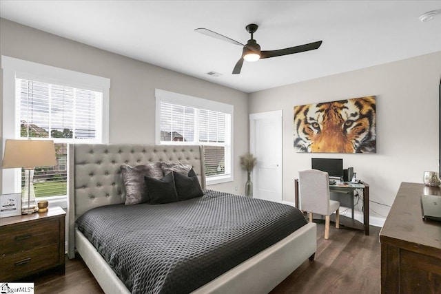 bedroom featuring dark hardwood / wood-style flooring and ceiling fan