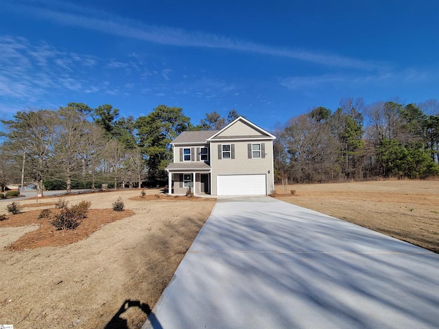 view of front of home featuring a porch and a garage