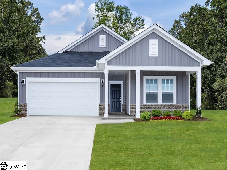 craftsman house featuring a porch, a front yard, and a garage