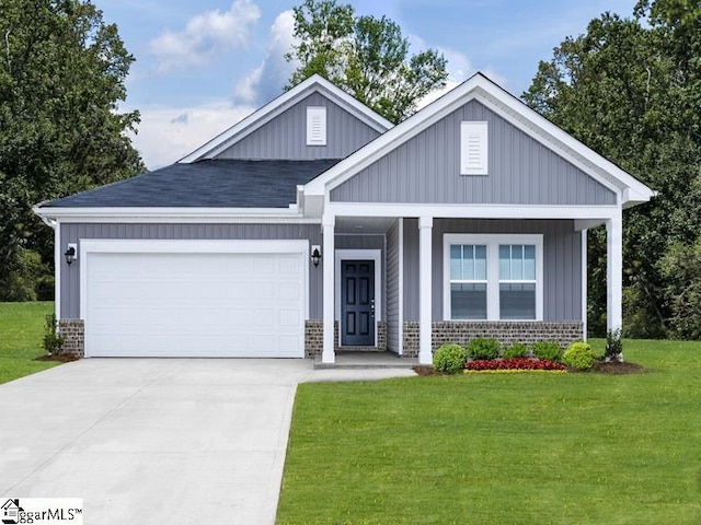 craftsman house featuring a porch, a front yard, and a garage