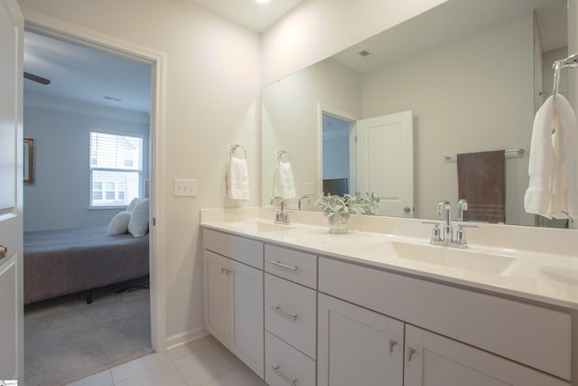 bathroom featuring tile patterned floors, vanity, and crown molding