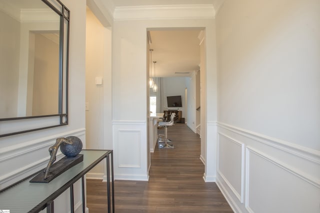 hall featuring dark hardwood / wood-style floors and ornamental molding