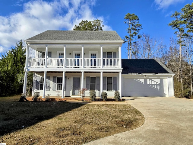 view of front of home featuring covered porch and a garage