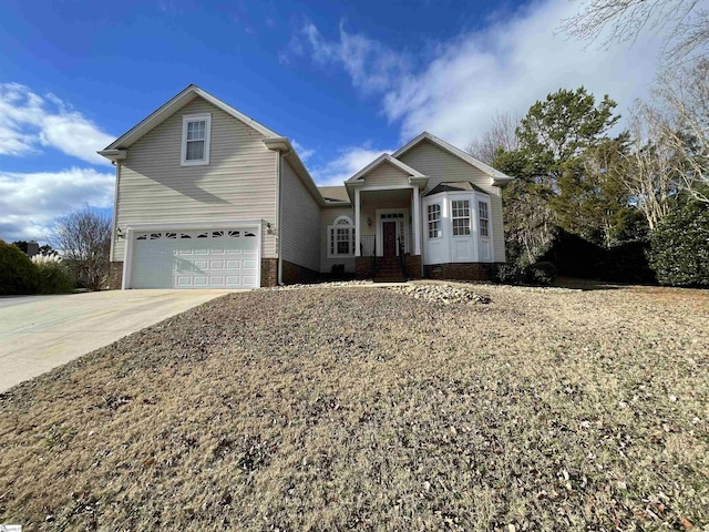 view of front of house featuring a garage and concrete driveway